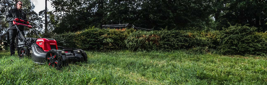 Man using Milwaukee 53cm Lawnmower