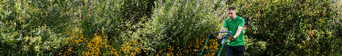 Man wearing John Deere branded polo shirt.